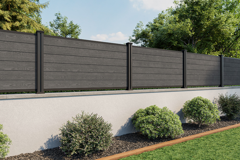 Modern composite fencing panels with black posts in a landscaped contemporary garden.