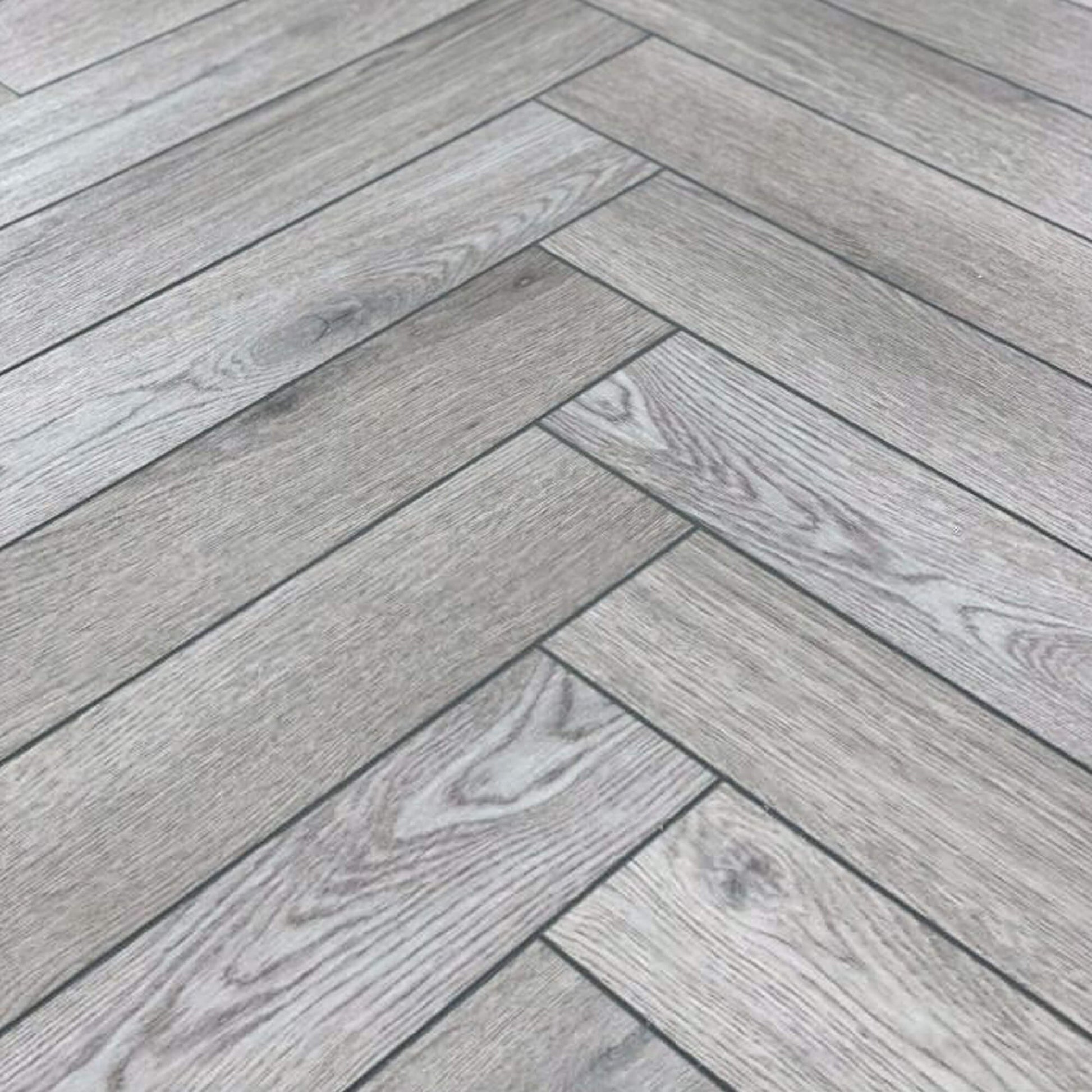 Close-up of Alsace Oak Rigid LVT Herringbone Flooring