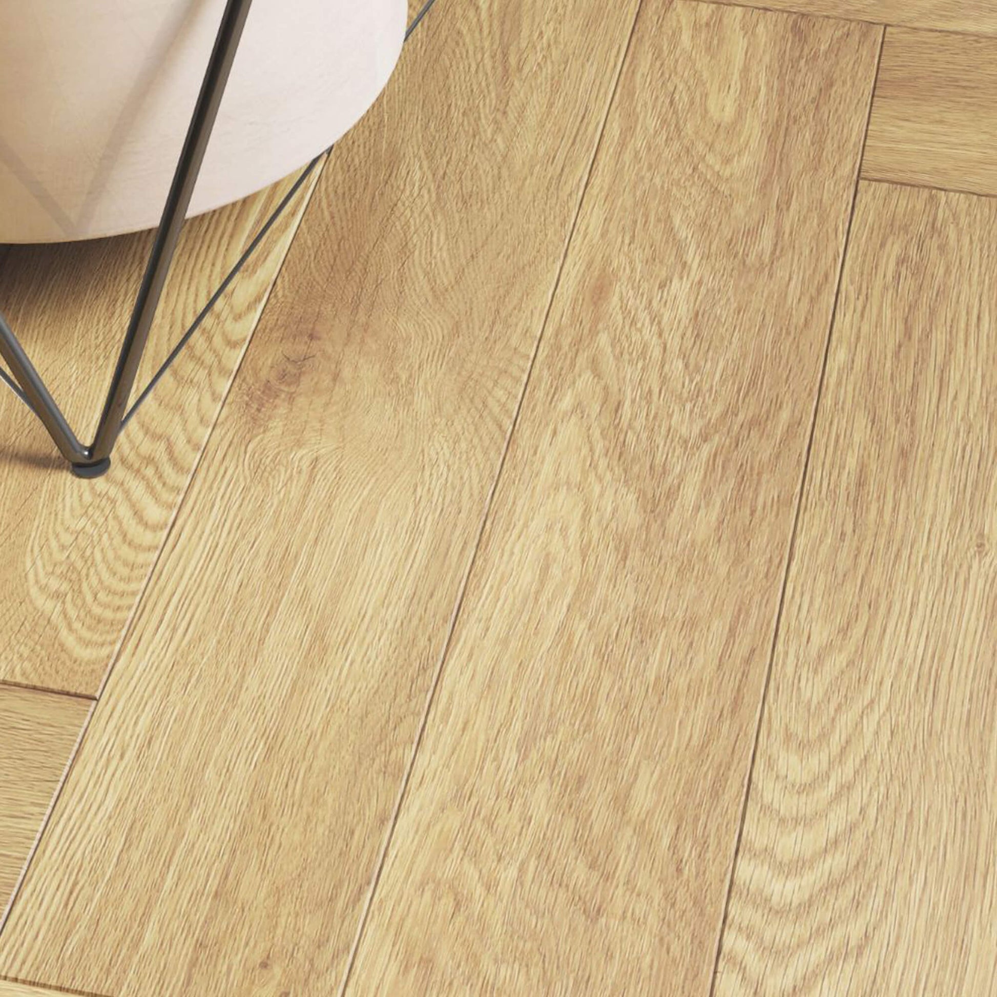 Close-up of the grain and texture of the Ashford Oak Herringbone Laminate Flooring.