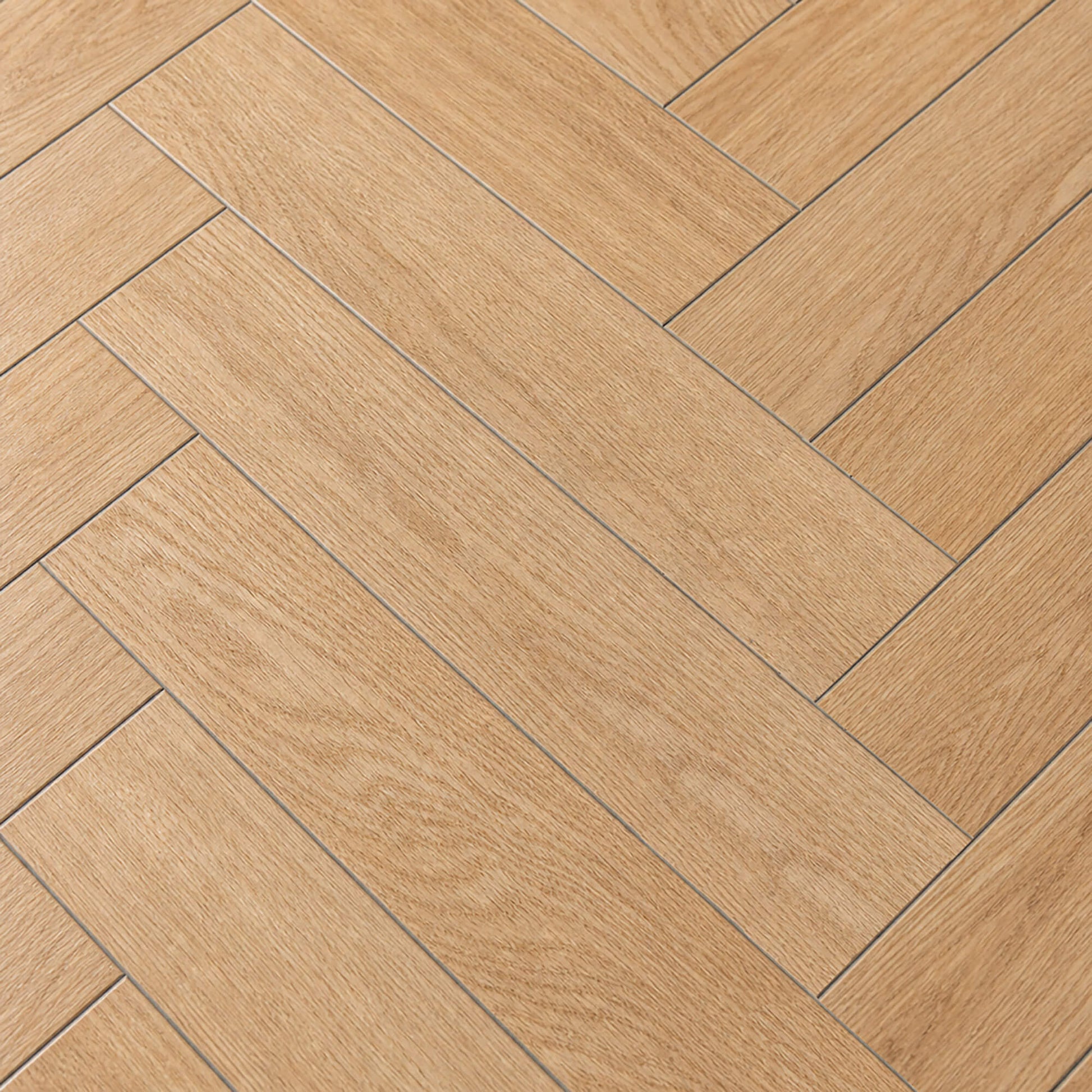 Close-up of the grain and texture of the Ashford Oak Herringbone laminate flooring.