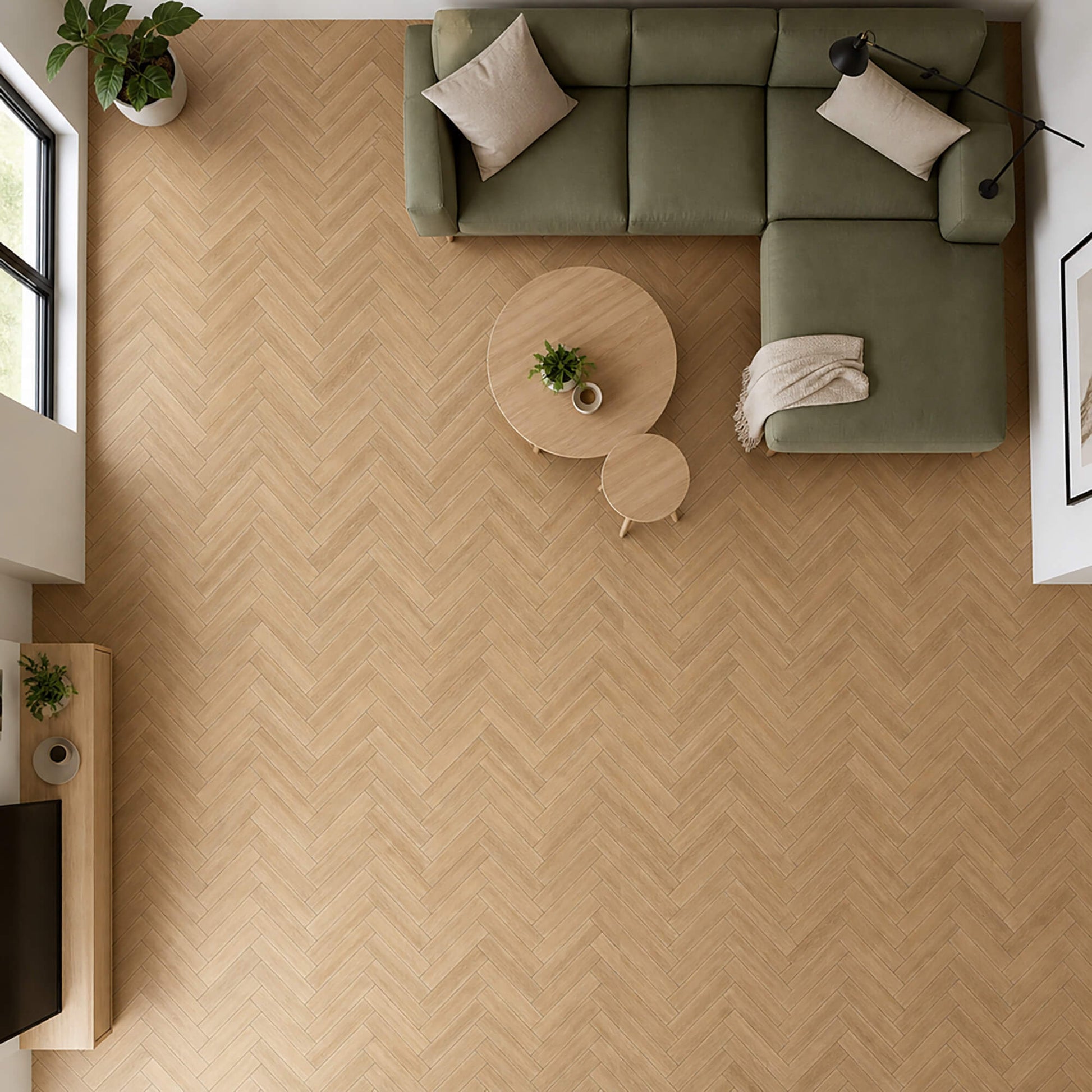 Elevated view of Ashford Oak Herringbone laminate flooring in a living room setting.