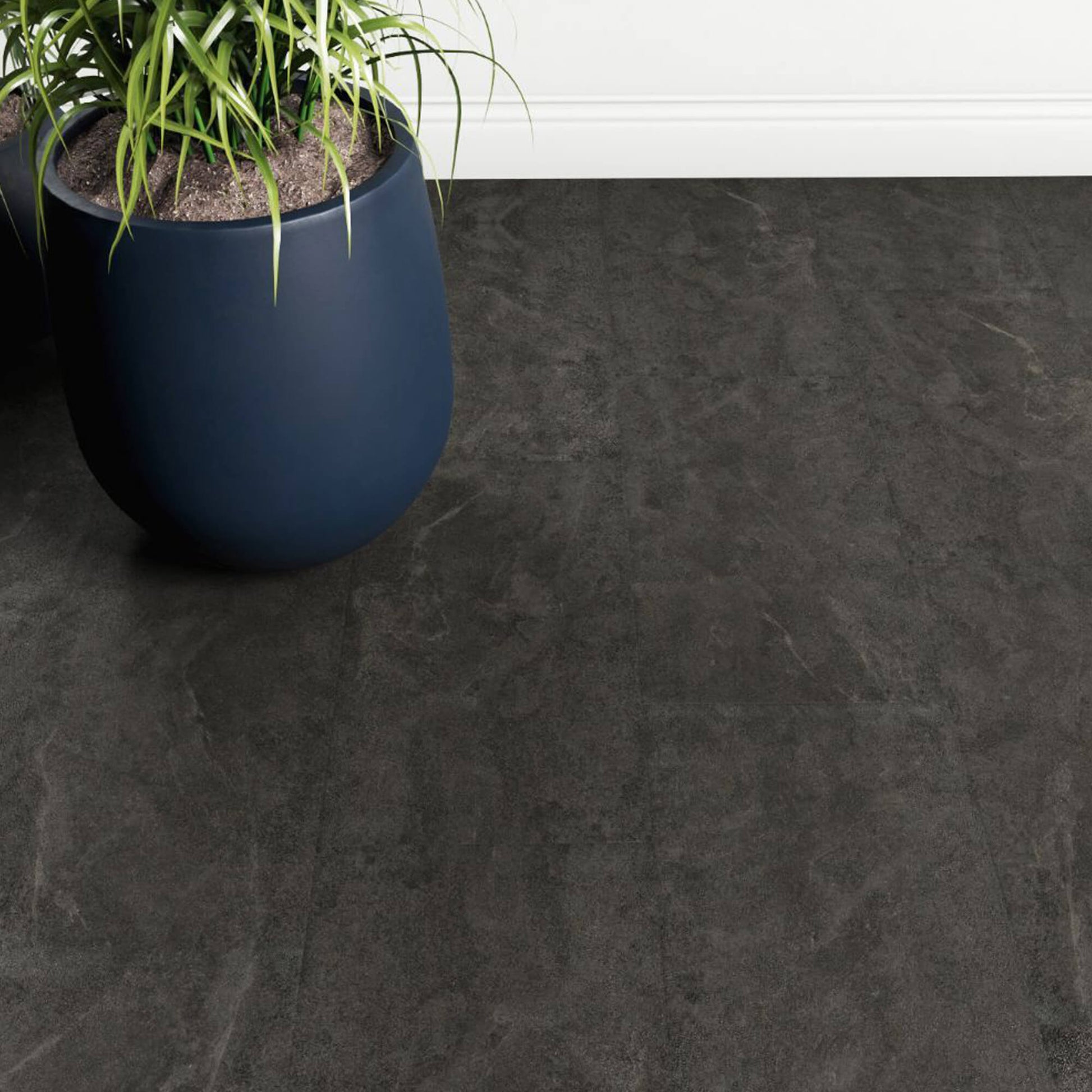 Black Slate Rigid LVT Floor Tiles in an interior room with a large blue plant pot in the corner.