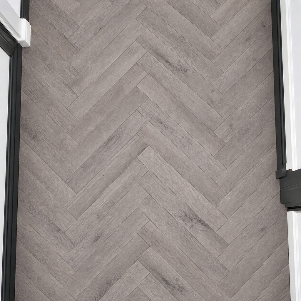 Elevated view of Castle Grey Herringbone laminate flooring.