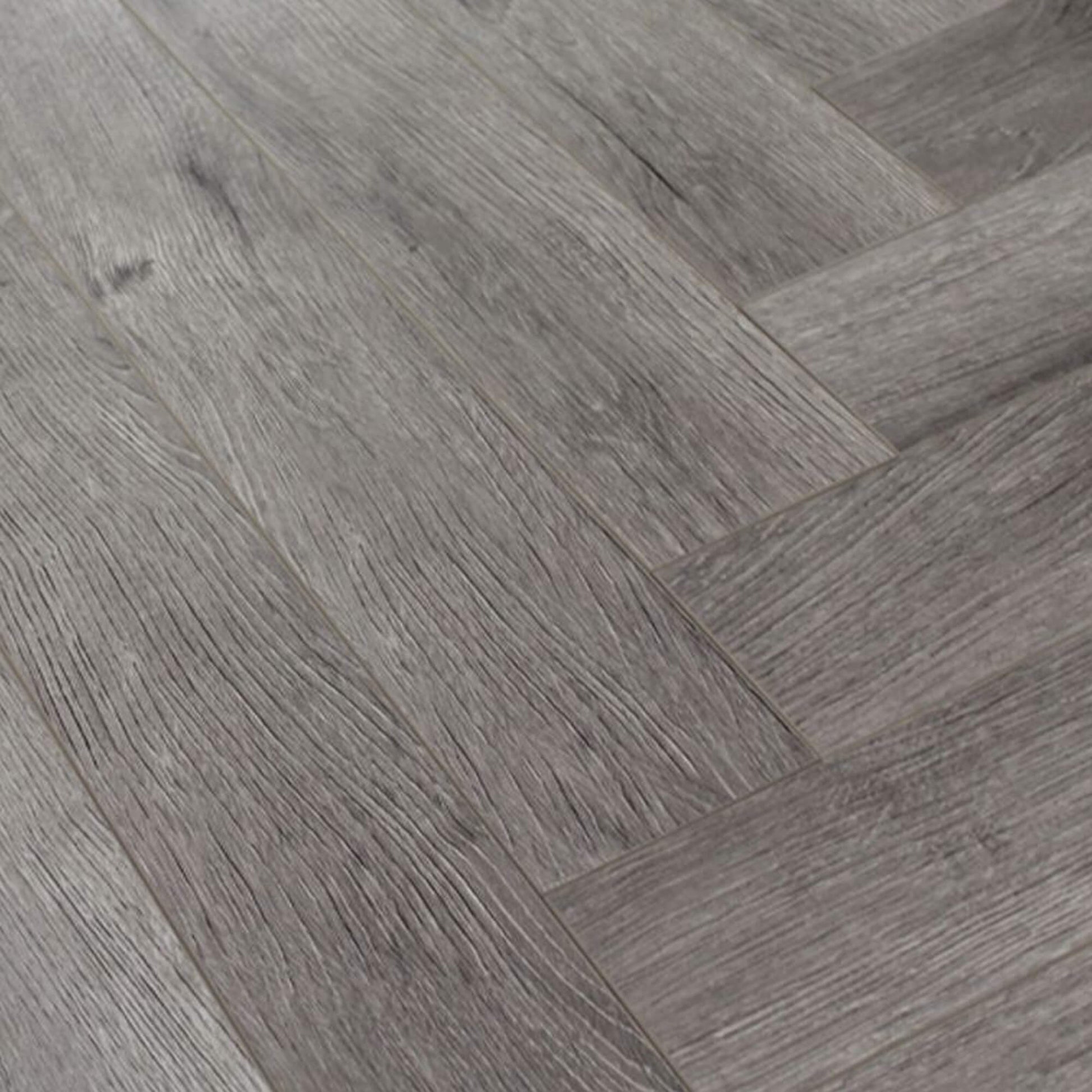 Close-up of Castle Grey Herringbone Laminate Flooring