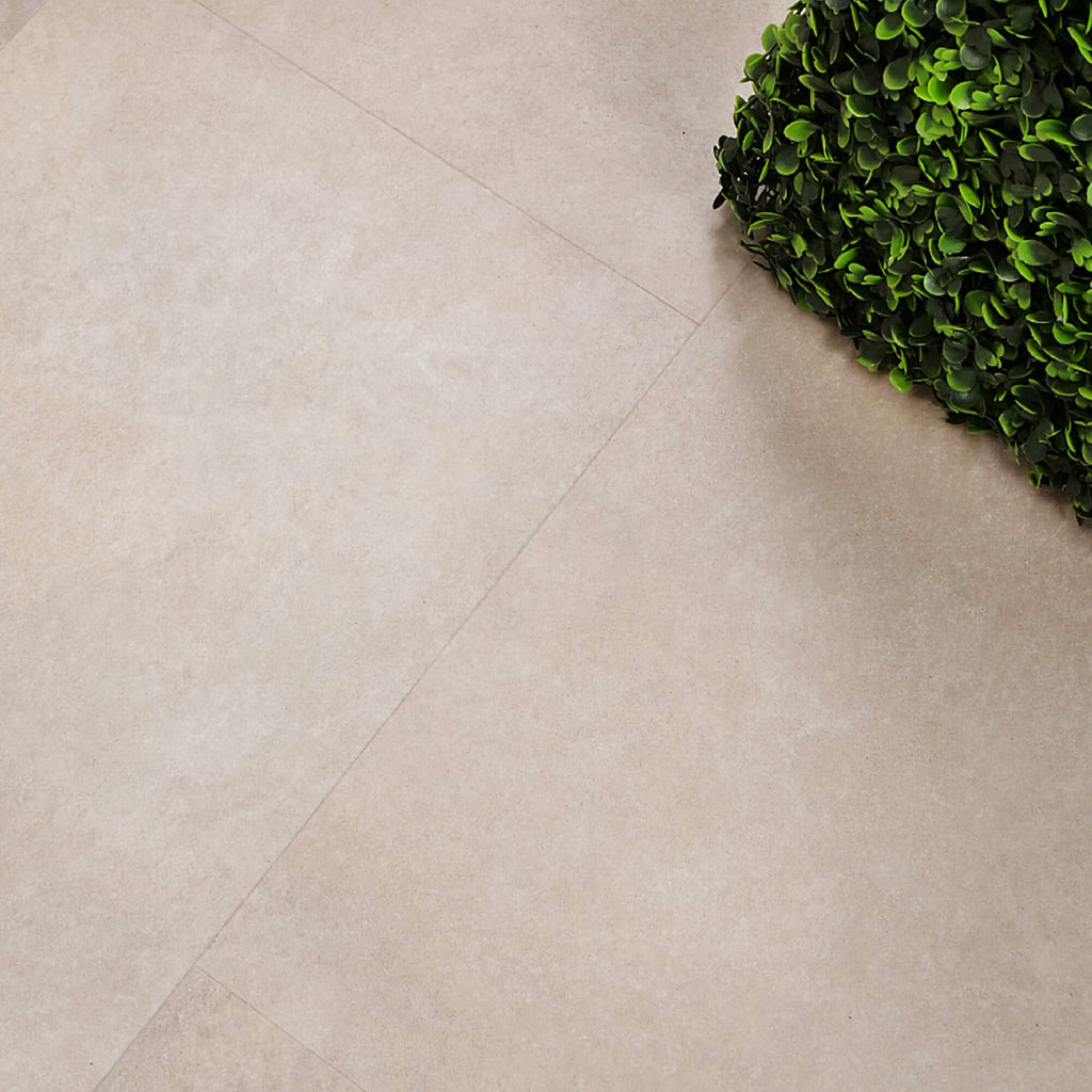 Close-up of Chianti Rigid LVT Floor Tiles with a green plant in the corner.