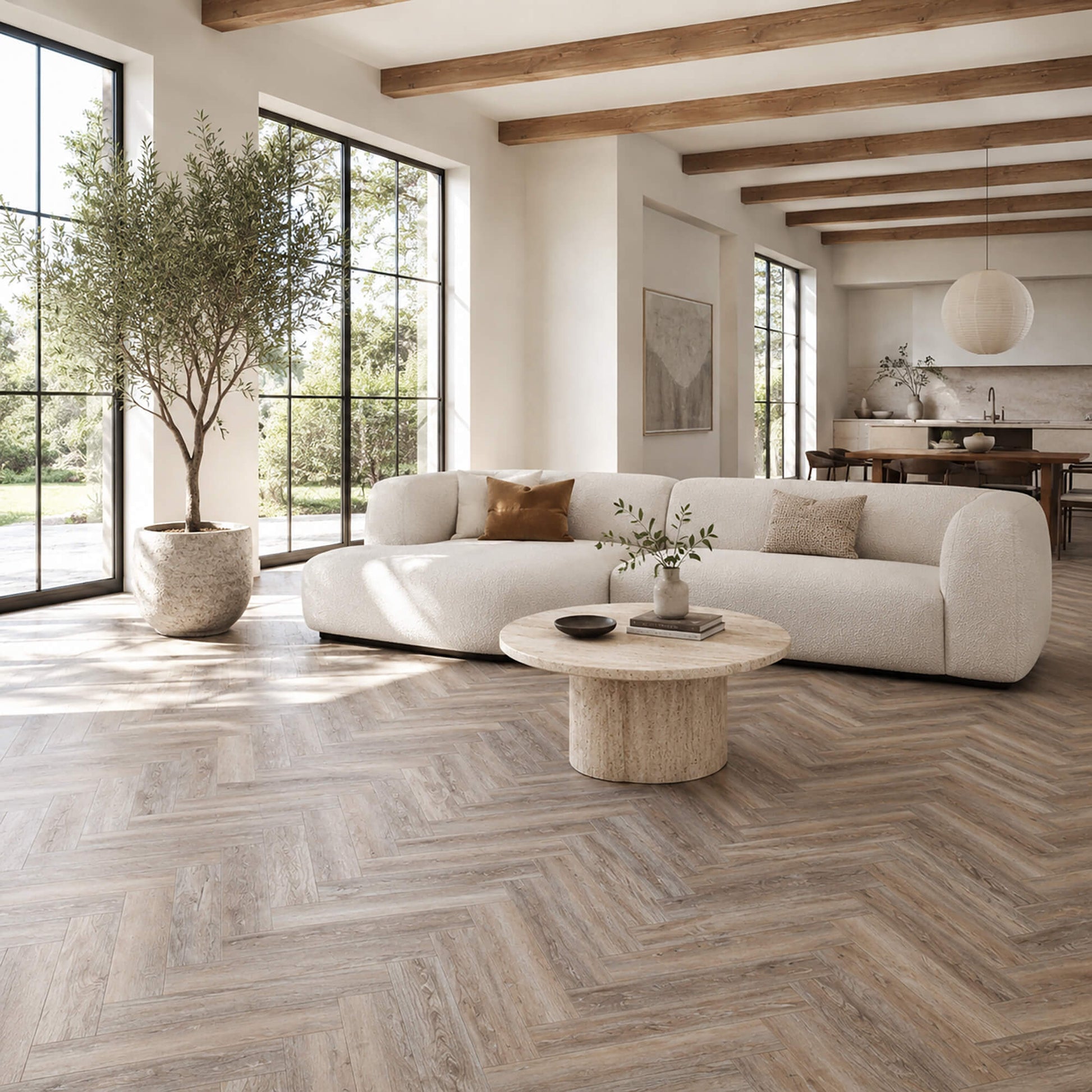 Driftwood Oak Rigid LVT Herringbone flooring in a living room setting.