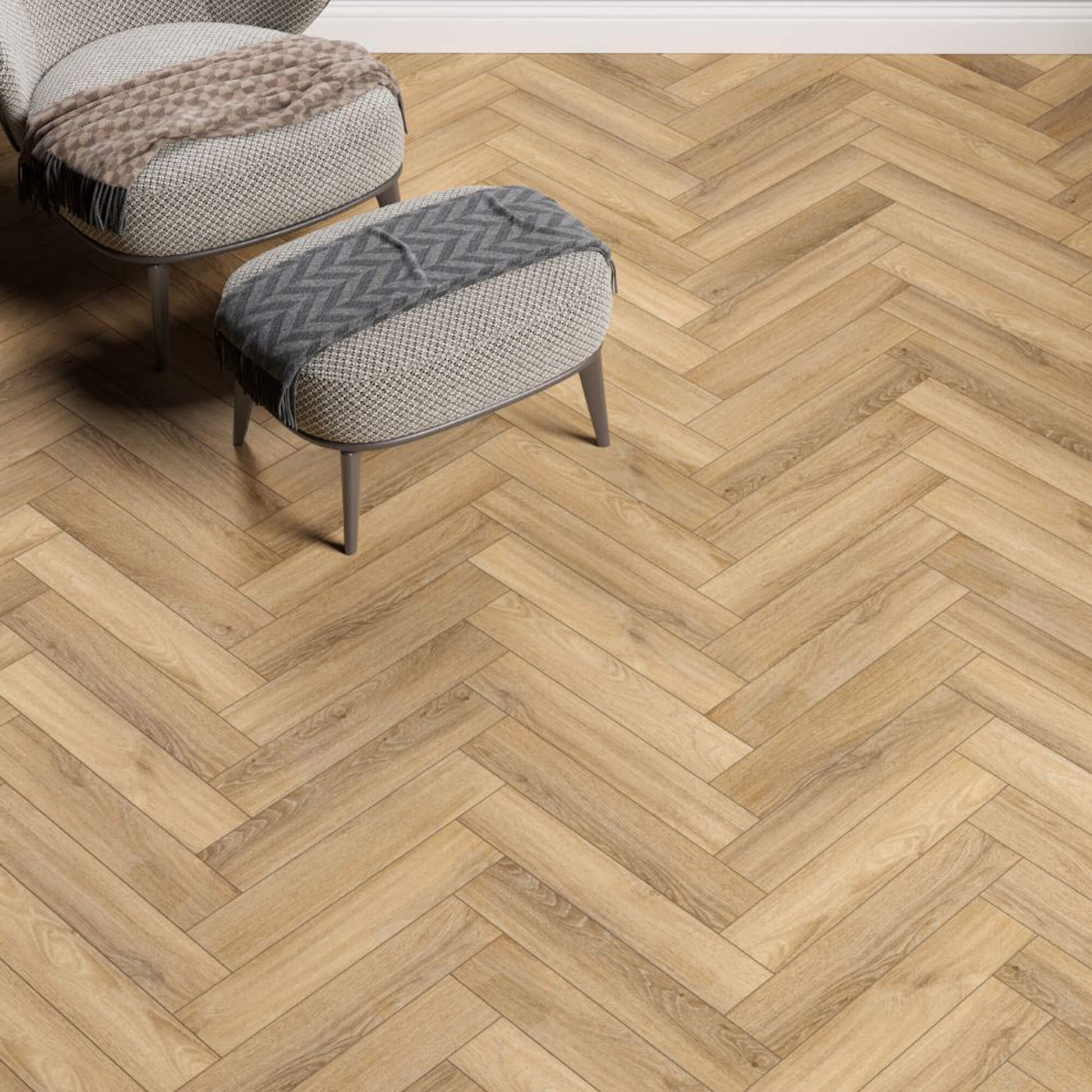 Forest Oak Rigid LVT Herringbone Flooring with a herringbone pattern and a small ottoman in the foreground.