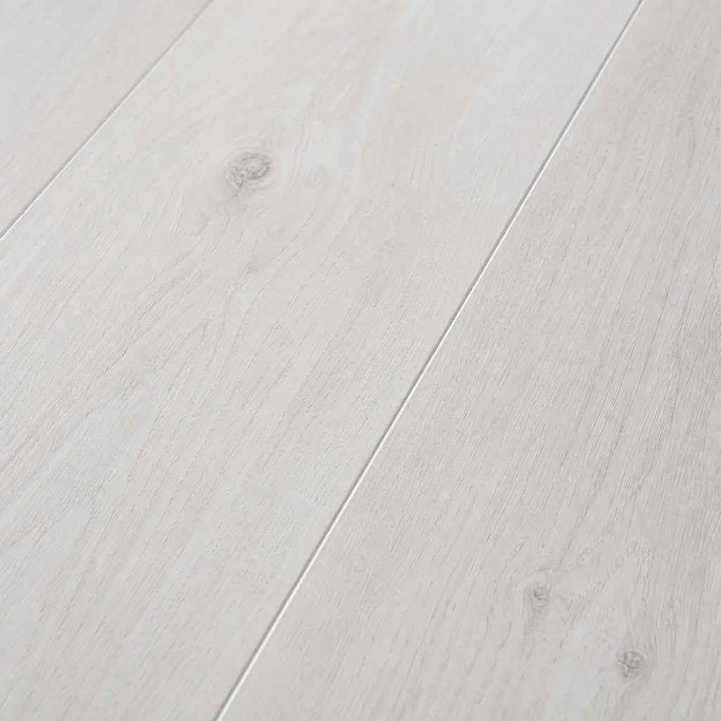 Close-up of the grain and texture of Fresco Snow Gloss laminate flooring.