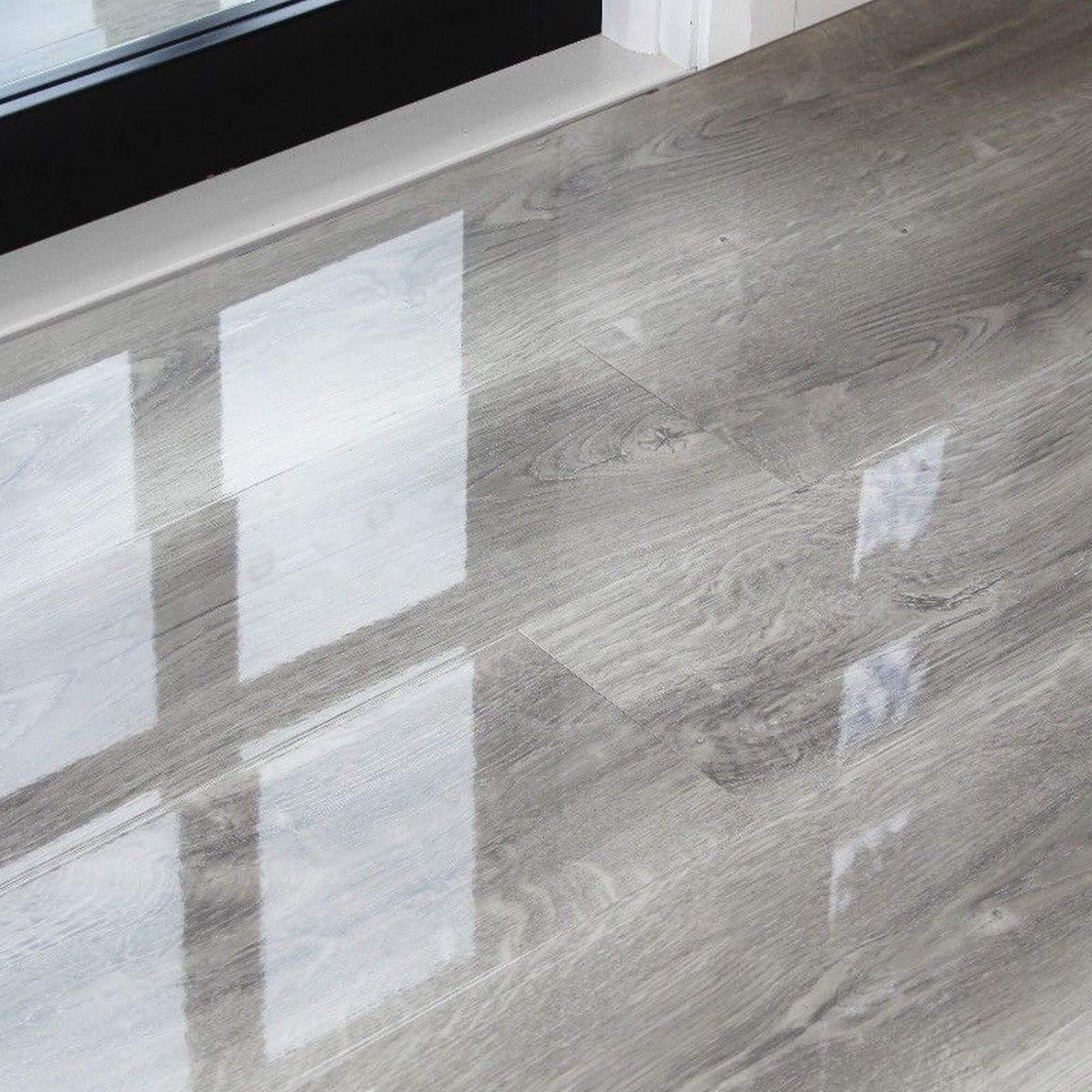 Manhattan Grey Super Gloss Laminate Flooring in a home interior setting