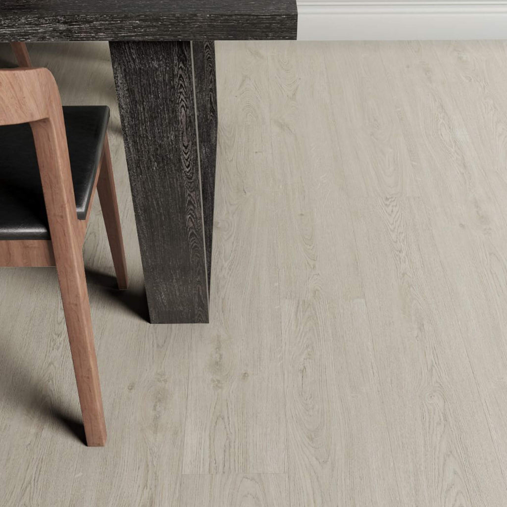Close-up of a wooden table leg on Marino Grey Rigid LVT flooring