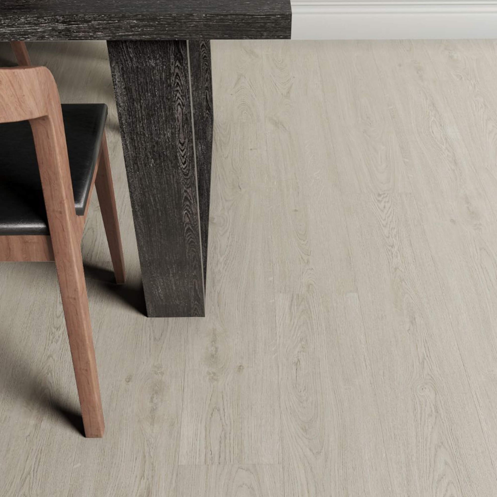 Close-up of a wooden table leg on Marino Grey Rigid LVT flooring