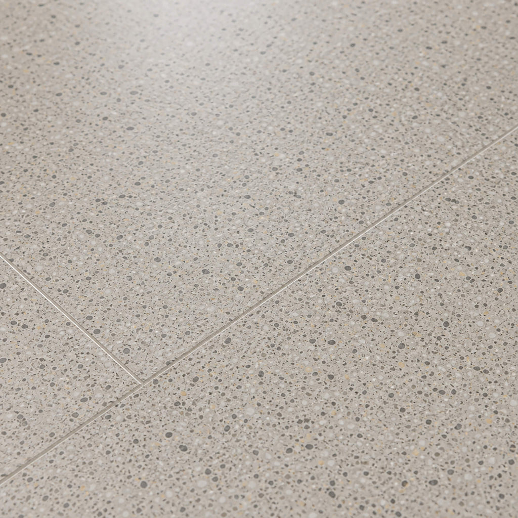 Close-up of Milano Terrazzo Rigid LVT floor tiles.
