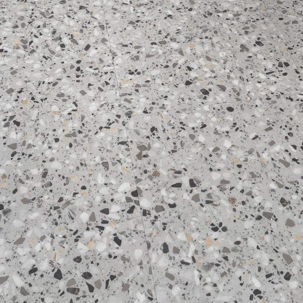 Close-up of Milano Terrazzo Rigid LVT floor tiles on a floor