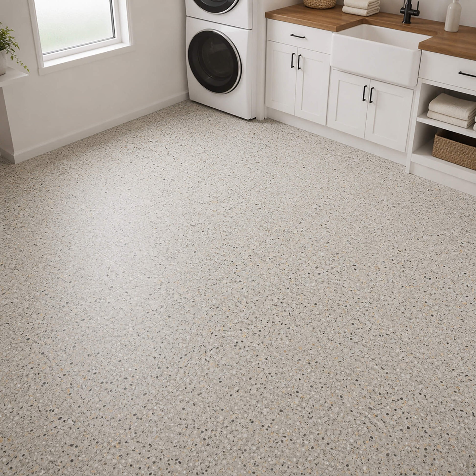 Milano Terrazzo Rigid LVT floor tiles in a utility laundry room setting.