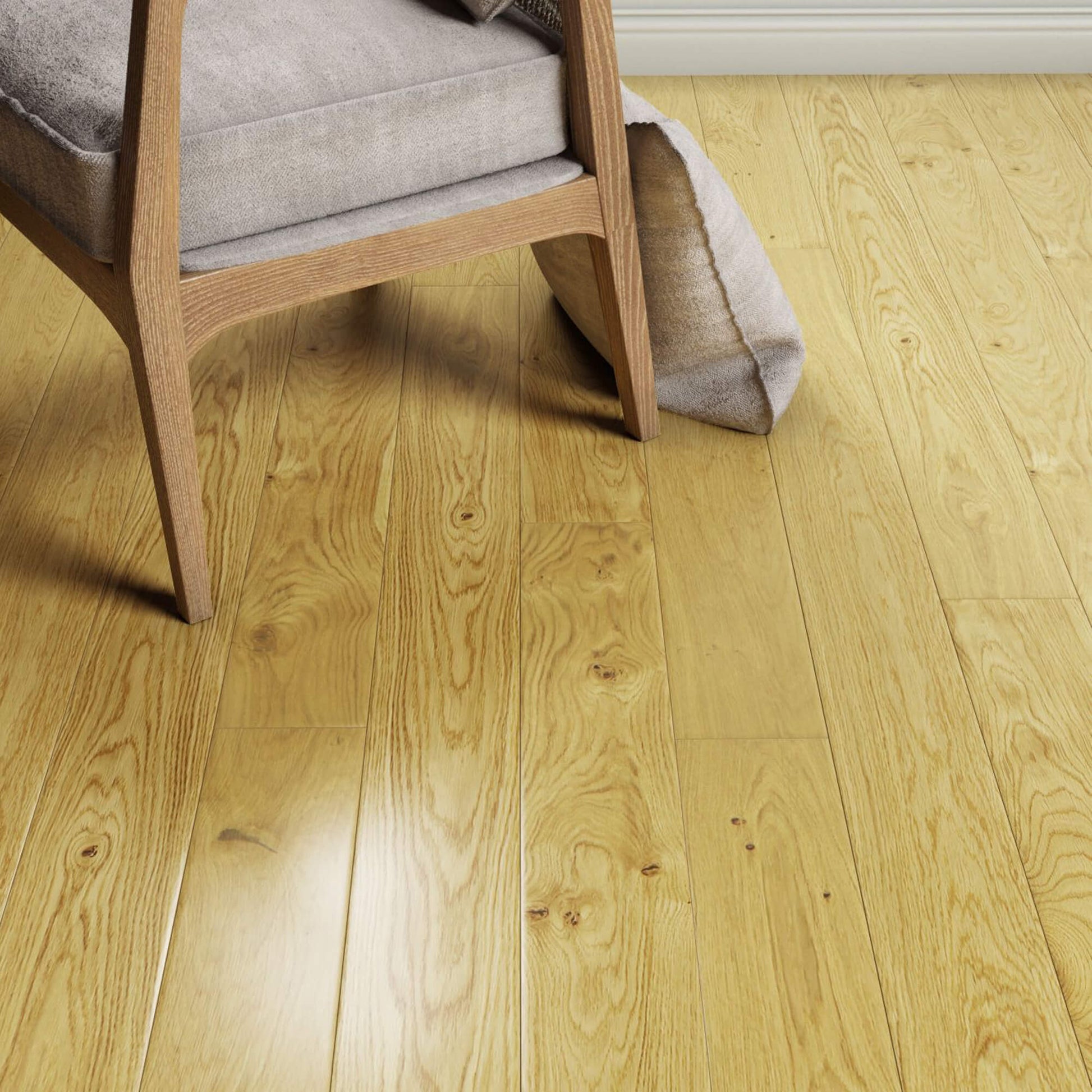 Natural Oak Lacquered 150mm Engineered Wood Flooring with a chair and rolled-up rug in the background