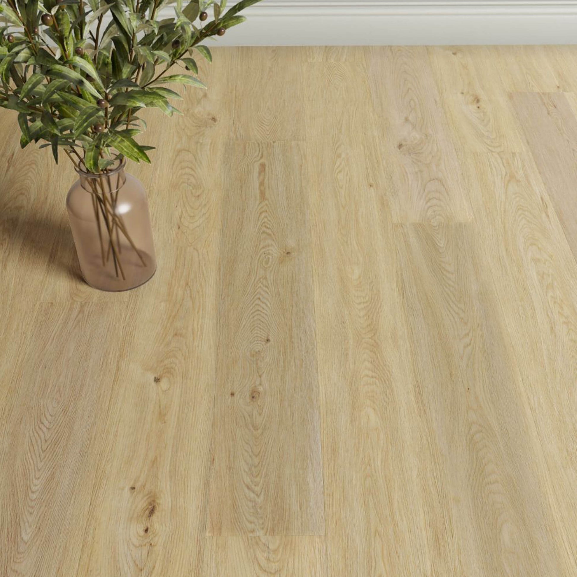 Natural Oak Rigid LVT flooring with a vase of plants on a white wall background