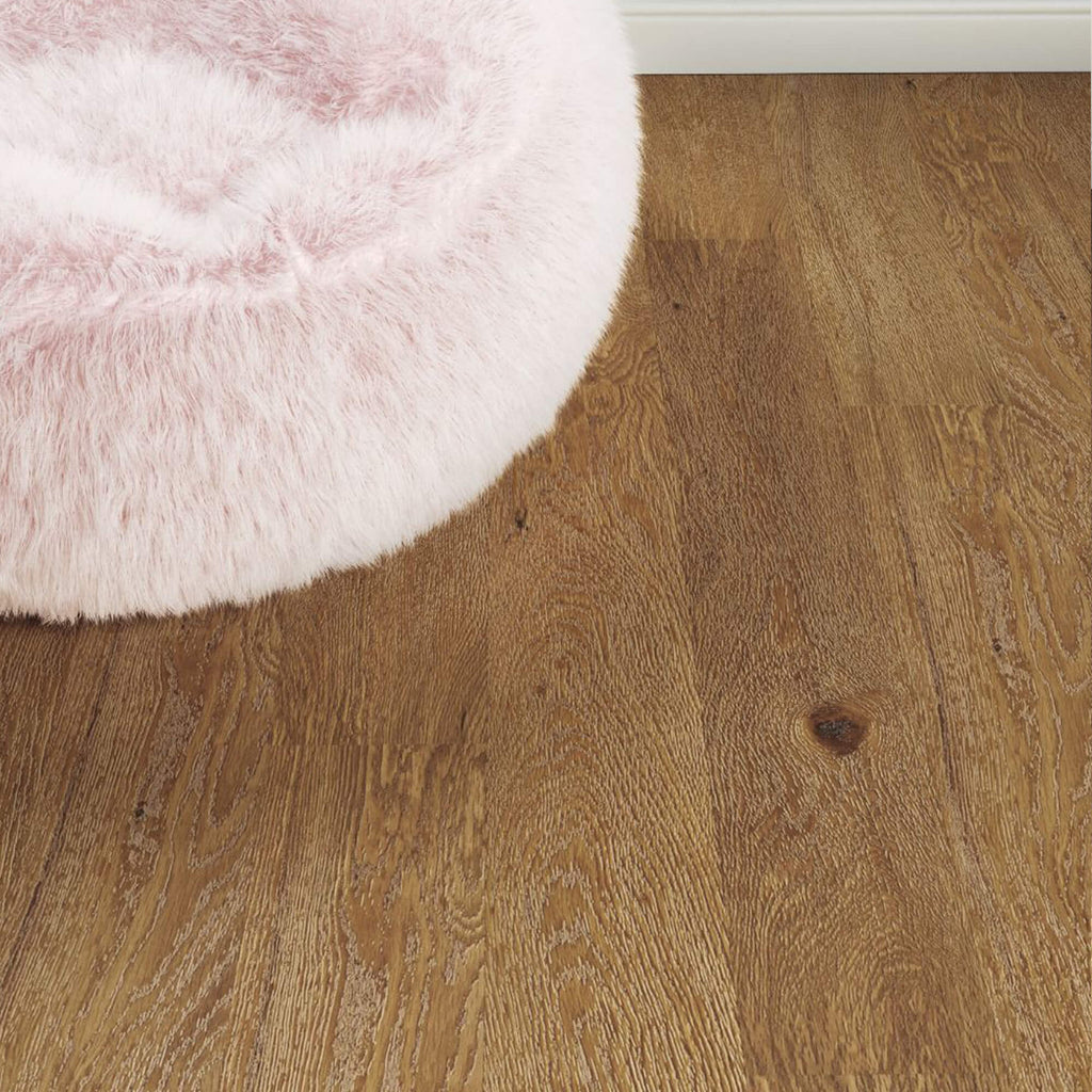 Natural Oak Prestige Laminate Flooring in a living room setting with a fluffy beanbag in the corner.