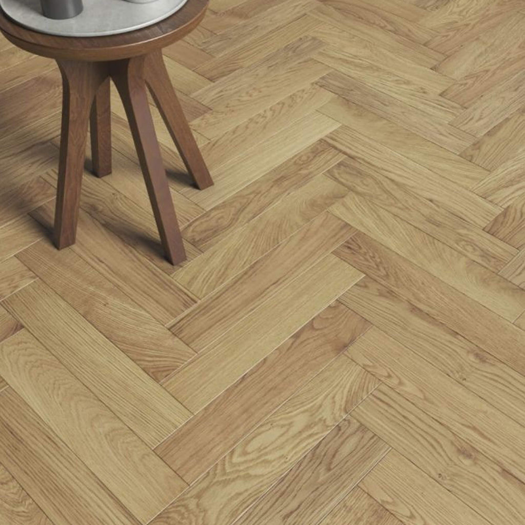 Wooden floor with Natural Oak Herringbone UV Oiled Engineered Wood Flooring and a small wooden table.