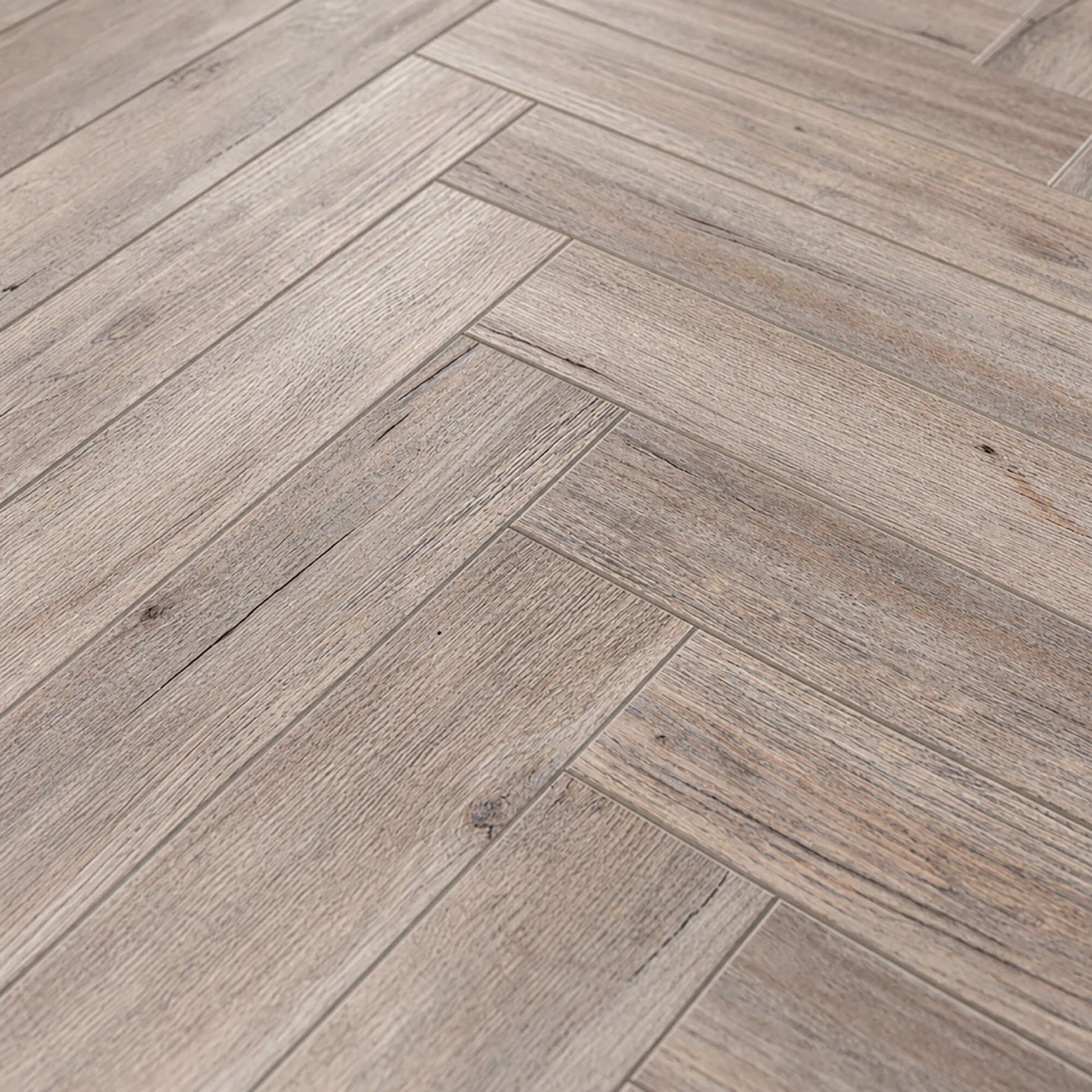 Close-up of Riviera Oak Rigid LVT Herringbone Flooring.