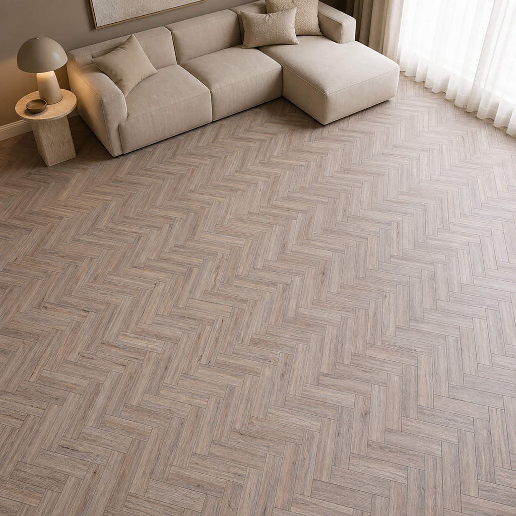 Riviera Oak rigid LVT herringbone flooring in a home living room setting.