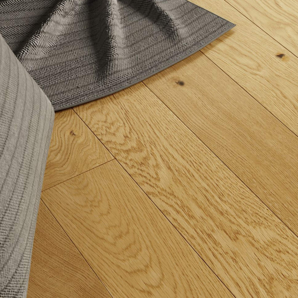 Close-up of Rustic Oak Lacquered 125mm Engineered Wood Flooring with a grey rug and fabric.