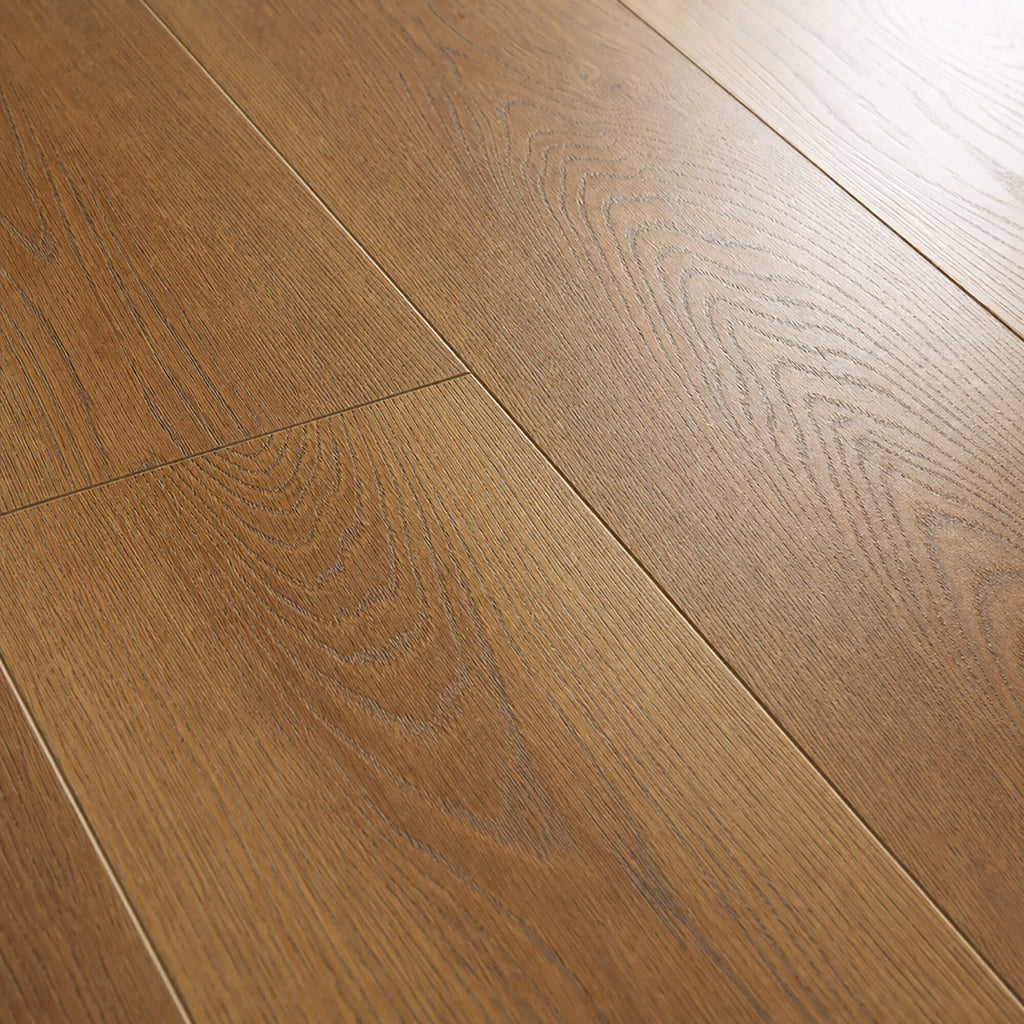 Close-up of visible grain patterns and subtle light reflections of Sable Oak Prestige Plus laminate flooring.