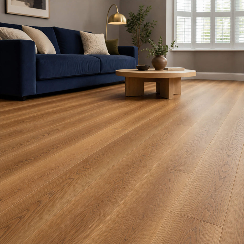 Sable Oak Prestige Plus laminate flooring in a home living room setting with a blue sofa and coffee table.