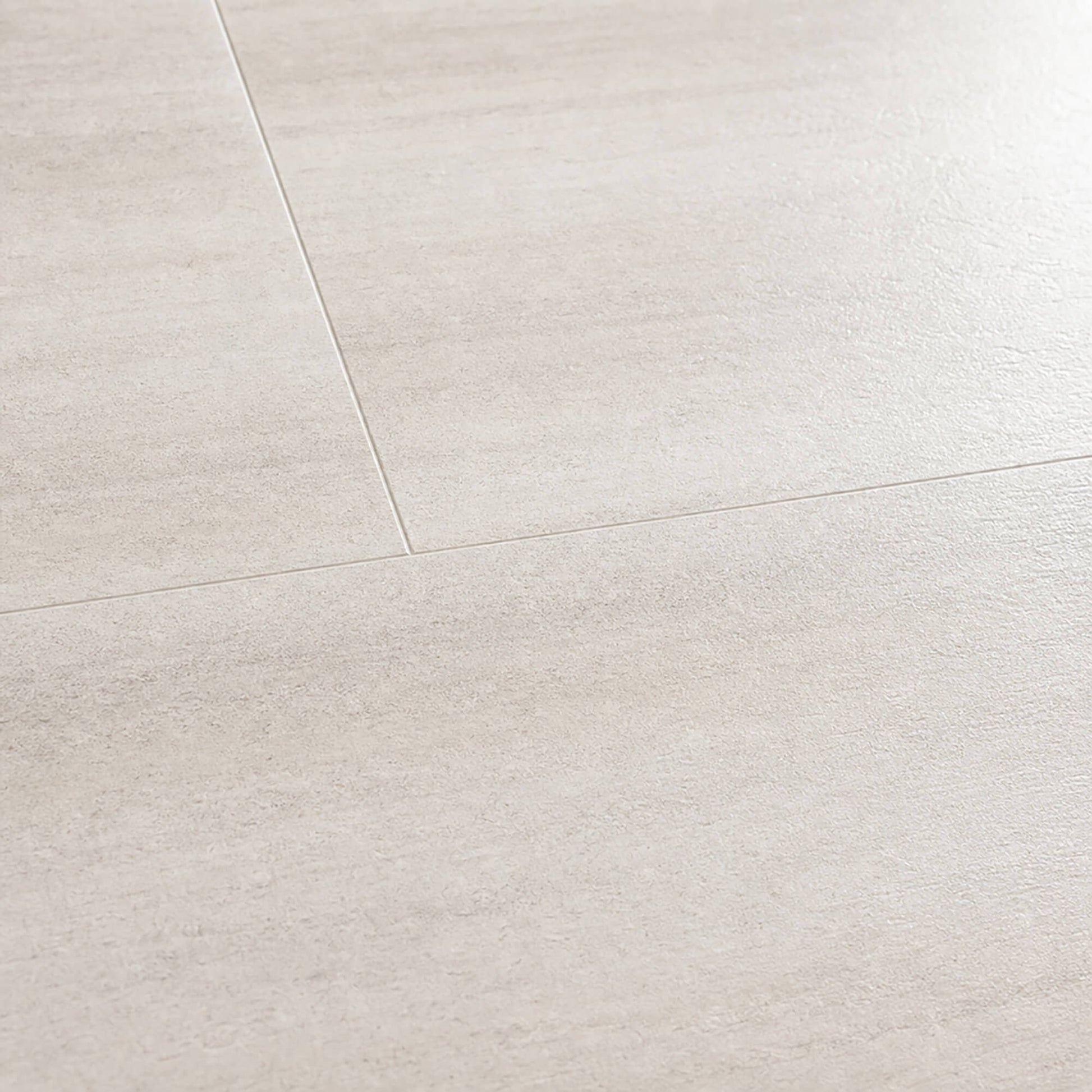 Close-up of the Sandstone Rigid LVT floor tiles.