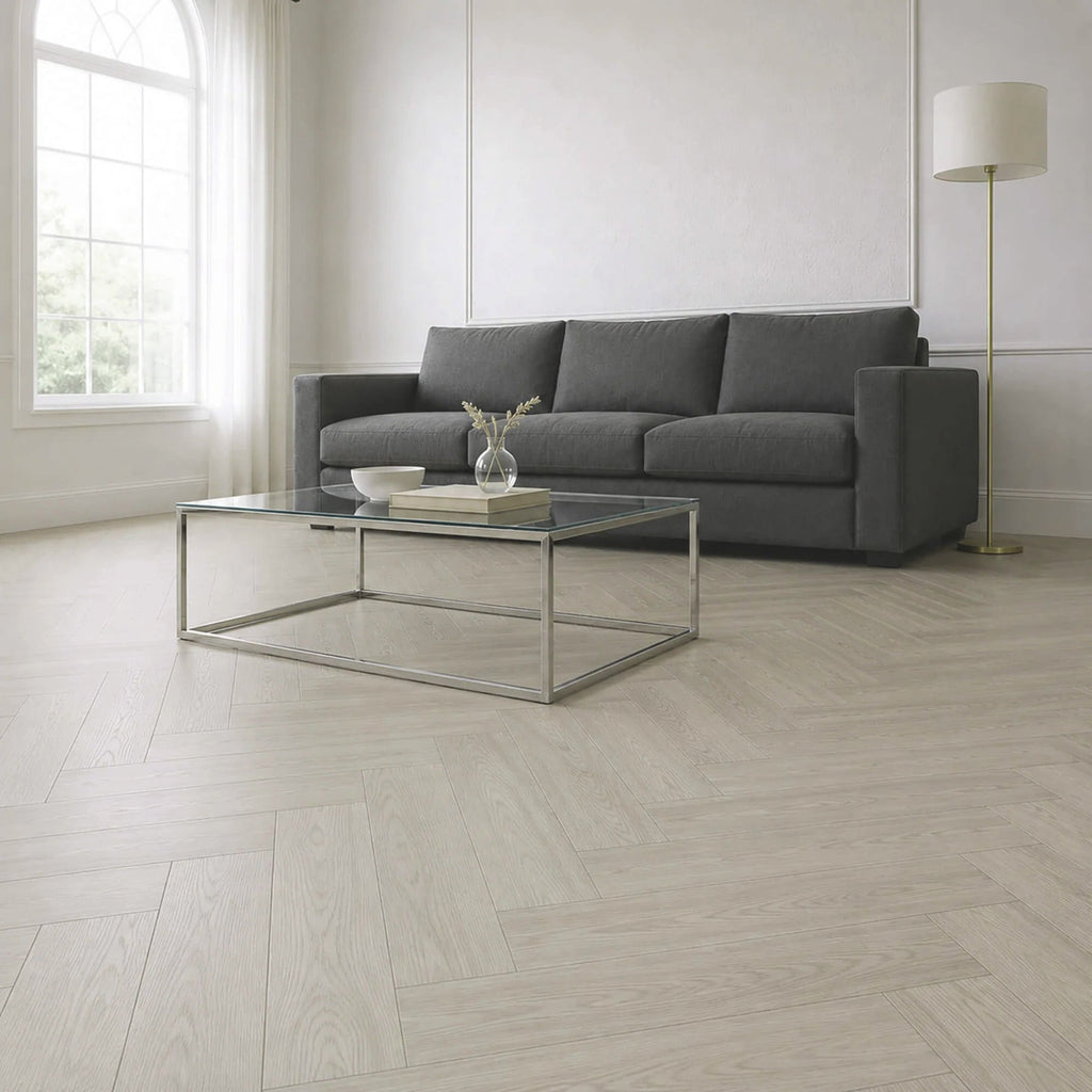 a warm grey herringbone vinyl floor in a neutral coloured room with contemporary furniture