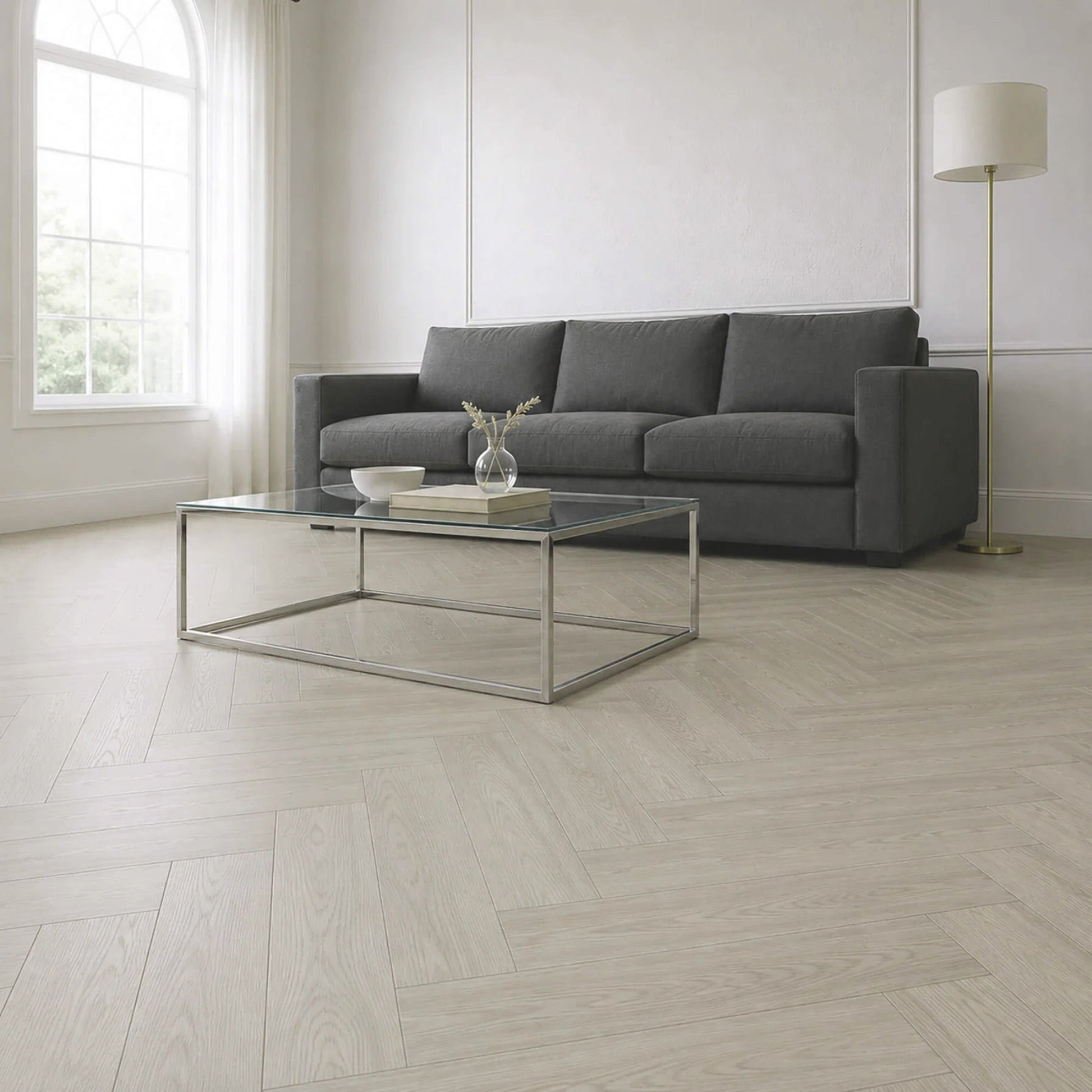 a warm grey herringbone vinyl floor in a neutral coloured room with contemporary furniture