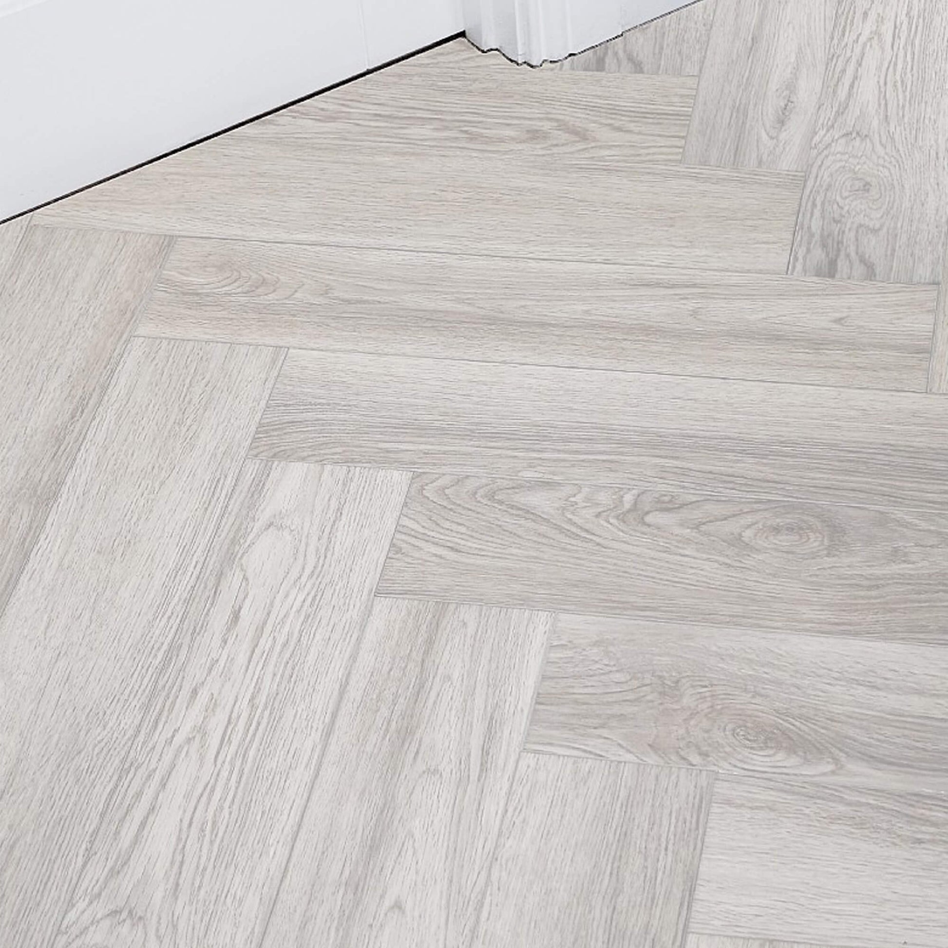 Siberian Oak Rigid LVT Herringbone Flooring in a room setting
