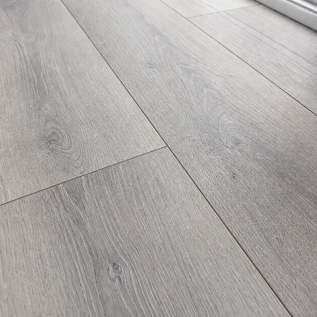 Close-up of the grain and texture of Silver Grey Oak Prestige laminate flooring.
