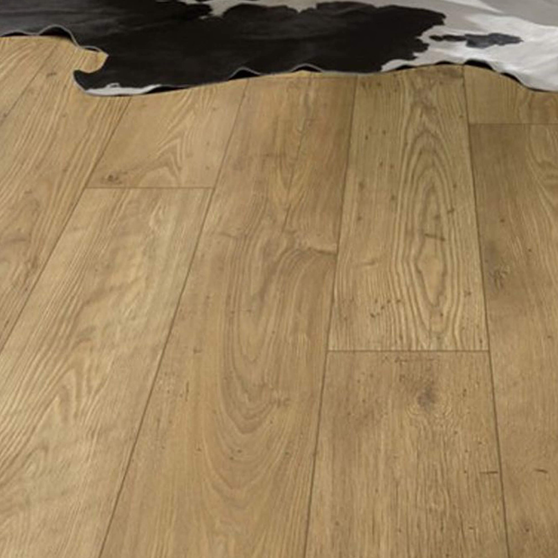 Tawny Chestnut Laminate Flooring with a skin rug in the background