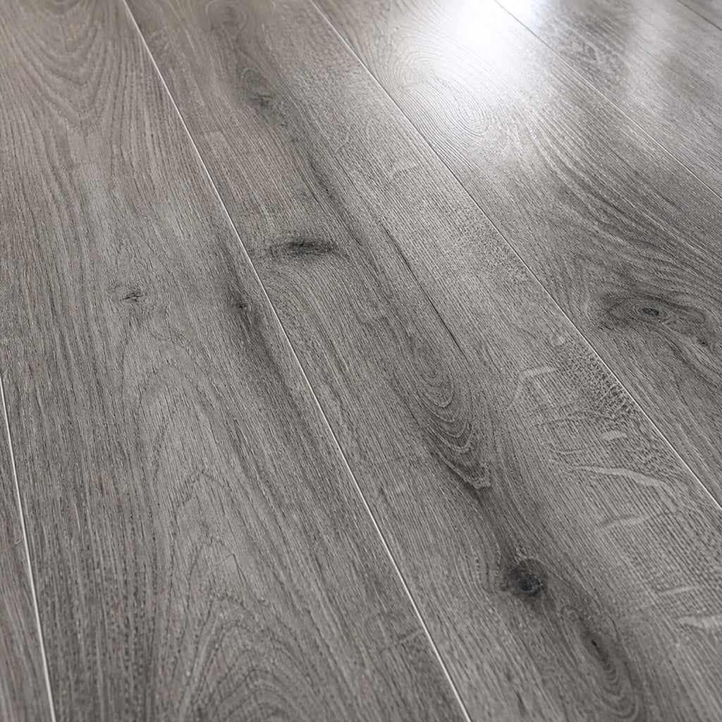 Close-up of the grain and texture on Uptown Oak Gloss laminate flooring.