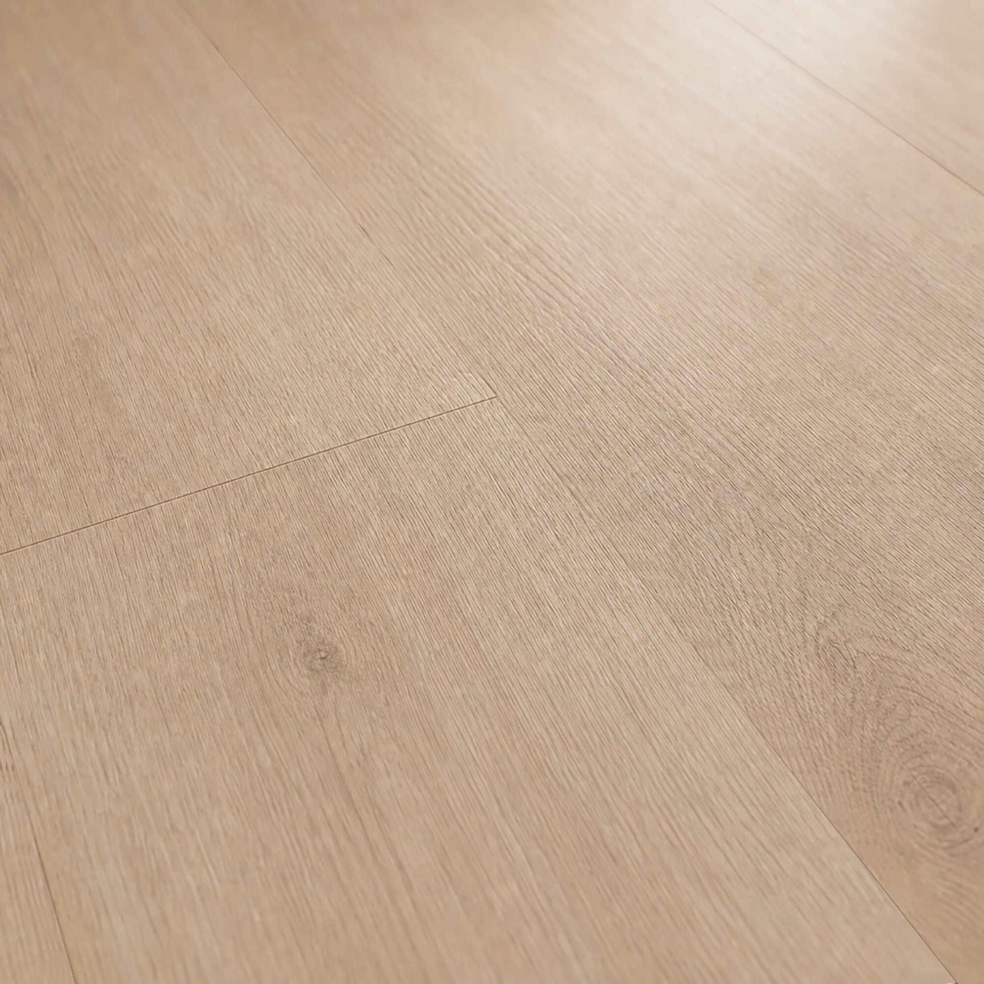 Close-up of the grain and texture of Washed Oak Essentials laminate flooring.