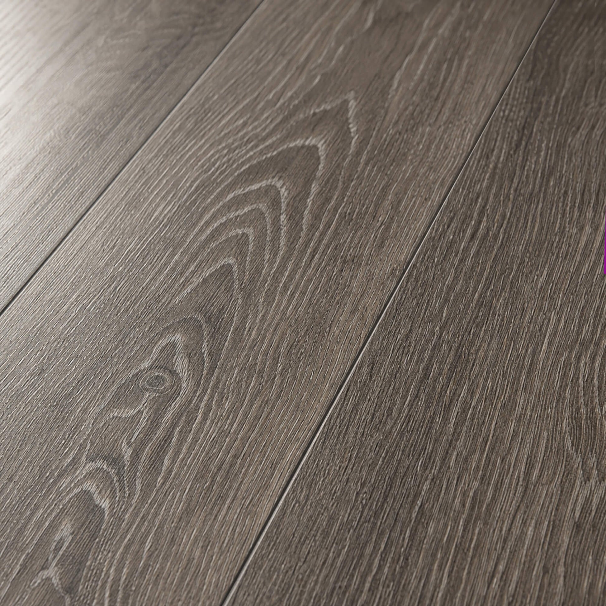 Close-up of Weathered Oak Rigid LVT flooring planks. 